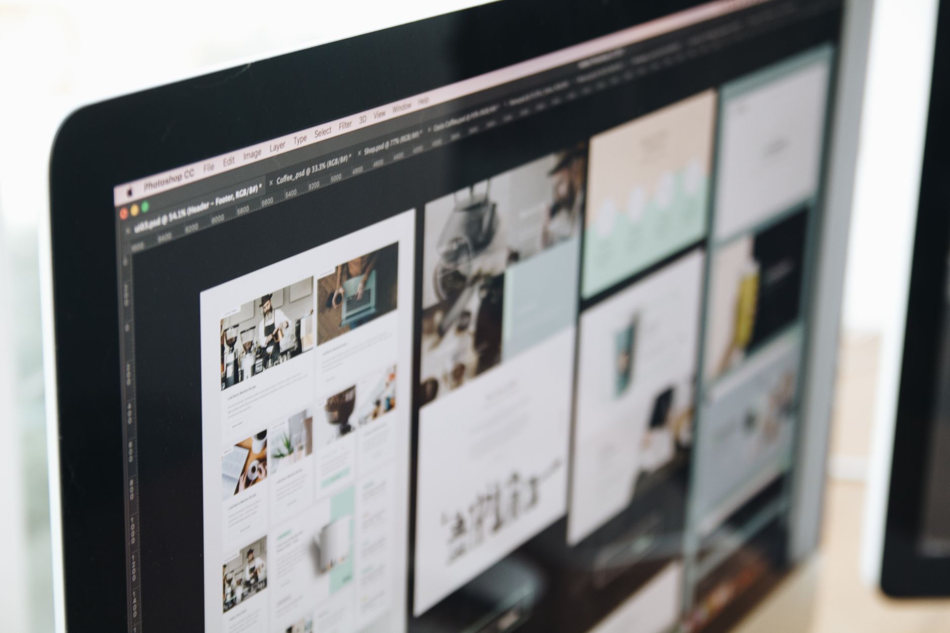 Digital workspace depicting book layout software grids on high contrast monitor